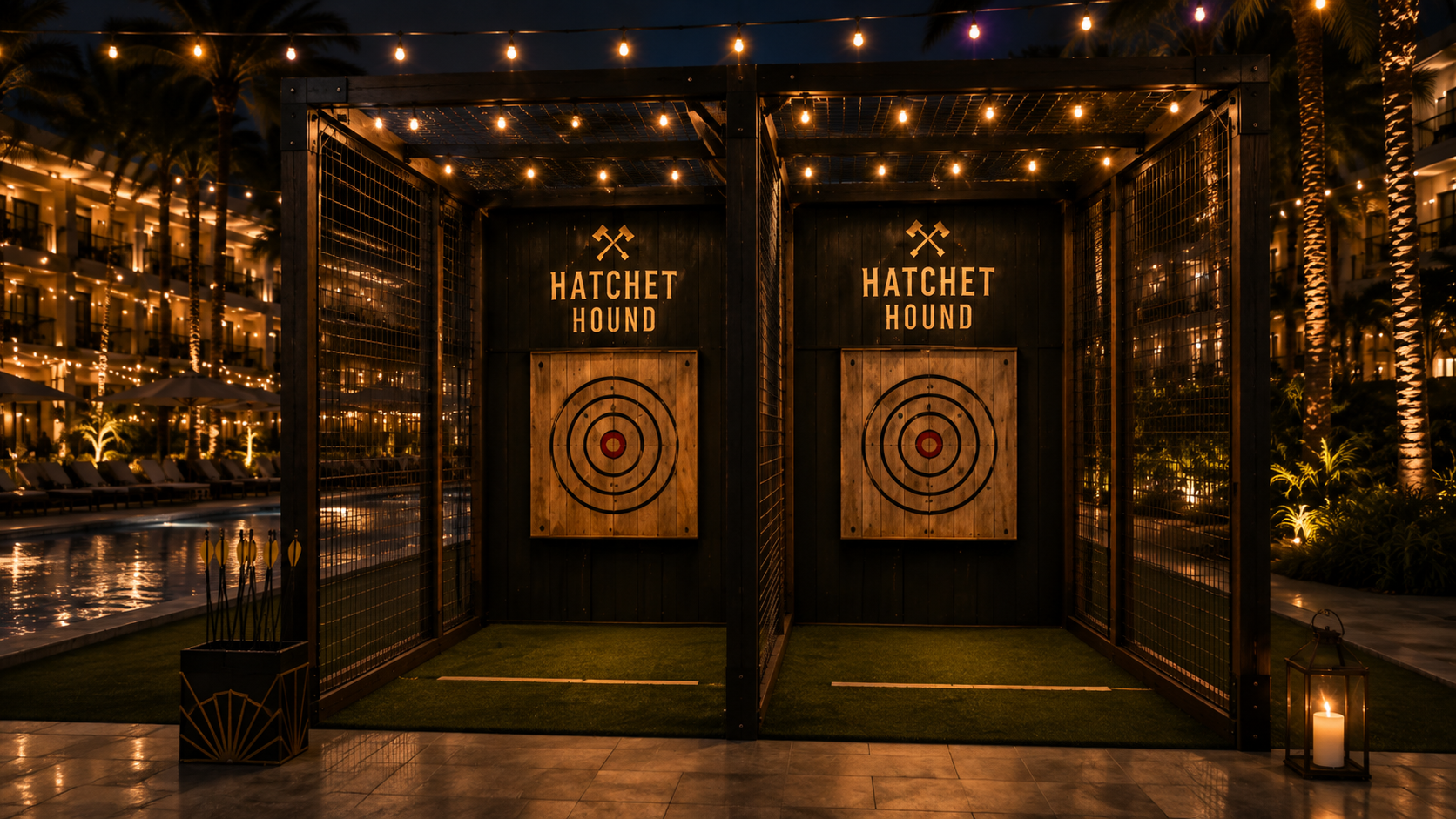 Two-lane Hatchet Hound axe throwing bay lit up poolside at a resort venue in the evening