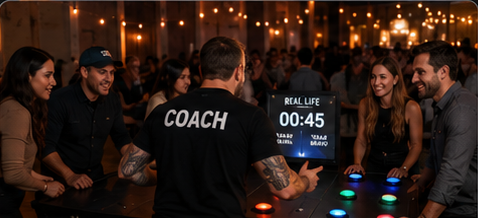 Guests laughing with a Real Life Events coach at a hosted game table